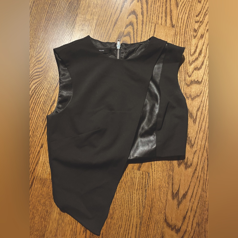 Asymmetrical black crop top by cara cheung.